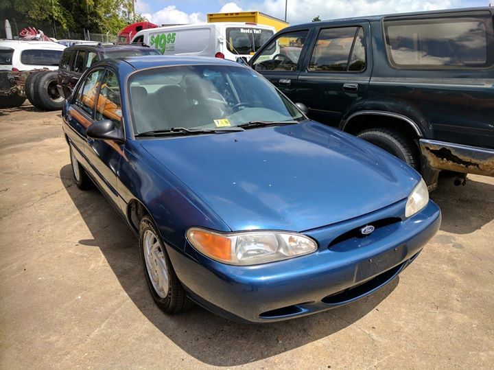 blue 90's ford escort sedan