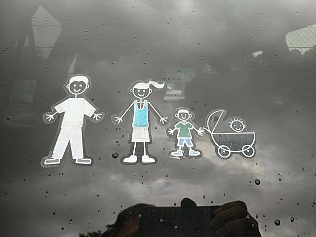stick figure family on the back car window 