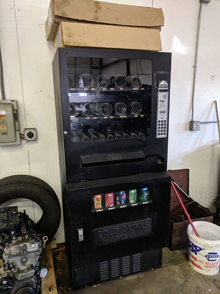 used vending machine with sodas and snacks offered in one unit