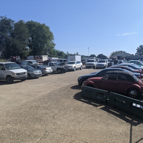 Row of cheap cars for sale in Richmond VA at a local dealer ready for auction